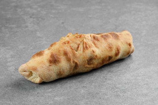Chicken fillet rolled and baked in dough with cabbage, tomato and cheese