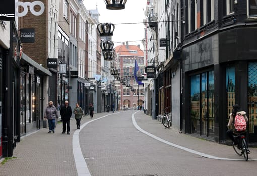 The Hague, Netherlands - April 17, 2023: Noordeinde - an elegant shopping street in The Hague, the Netherlands