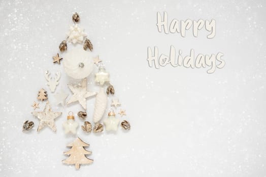 Whiter Background With A Christmas Tree Out Of Christmas Decoration, With A Label With Text Happy Holidays