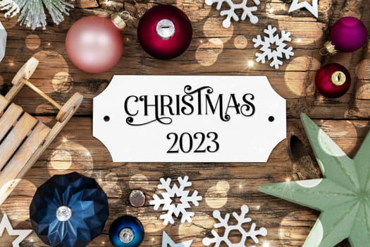 Colorful Christmas Decor With Bokeh, Christmas Balls And Snowflakes, With Sign With Text Christmas 2023