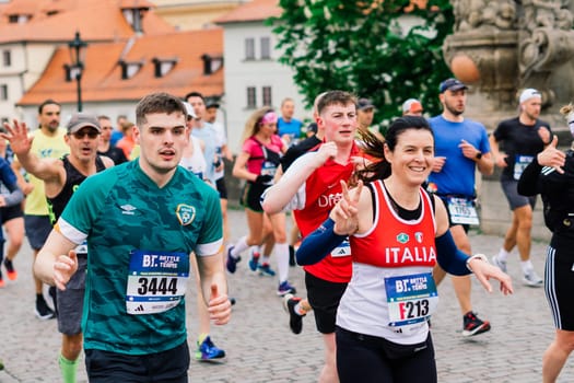 Prague, Czechia - 7th May 2023 - Group athletes runners run marathon in a sunlight