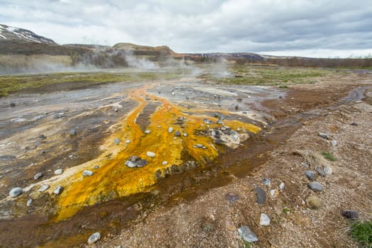 Colorful rock at the geothermal field around Haukadalur geyser, Iceland