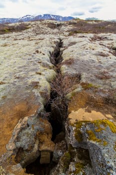 Crevice of continental rift between the American and European continental plates in Thingvellir National Park, Iceland