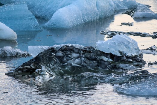 Ice pure like glass swimming in the Jokulsarlon glacial lake, Iceland