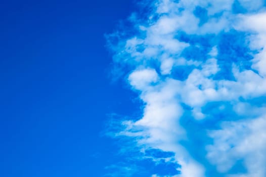 White cumulus clouds against the blue sky. White clouds. Blue sky. Fluffy cloud. Clear sunny day. Weather. Weather forecast. Summer season. Beauty in nature. Outdoors.