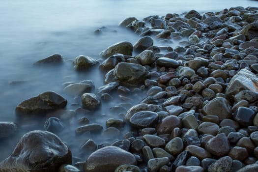 Time exposure of stones in the Westfjords coast, Iceland