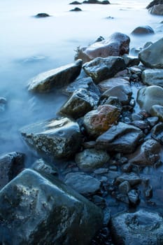 Time exposure of stones in the Westfjords coast, Iceland