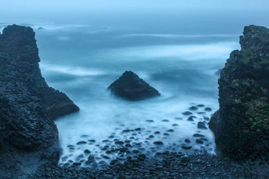 Stormy coastal landscape of Arnarstapi at night, Iceland