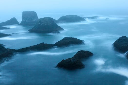Stormy coastal landscape of Arnarstapi at night, Iceland