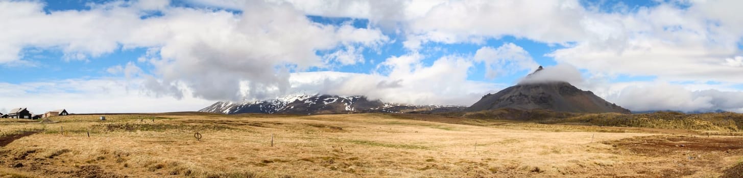 Panoramic view of mountainous Hellnar during a sunny summer day, Snaefellsnes National Park