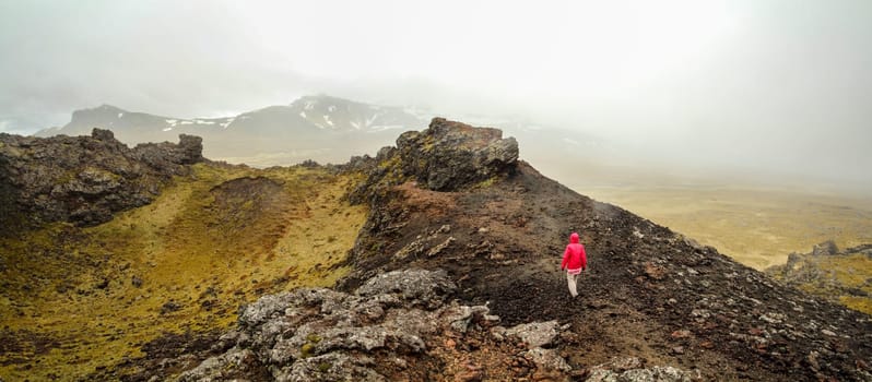 Panoramic view of volcanic crater landscape in Snaefellsnes National Park, hiker walking on the crater