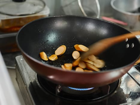 Cooking of sausage fried rice  with mixed vegetable .