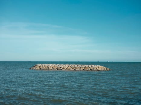Sea beach with stone wall and sand at  beach , Map Ta phut , Rayong ,Thailand.