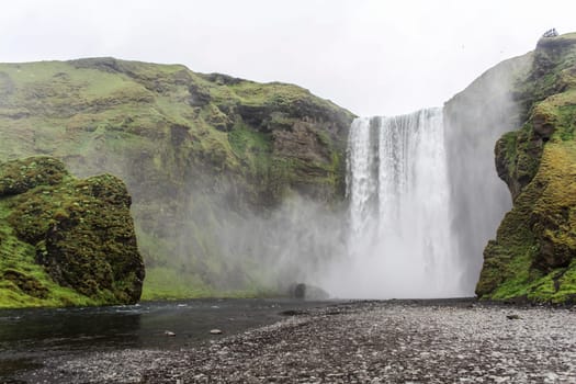 View on abandoned magnificent Skogarfoss waterfall in South Iceland