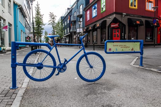 Blue bike as street barrier in Reykjavik, Iceland