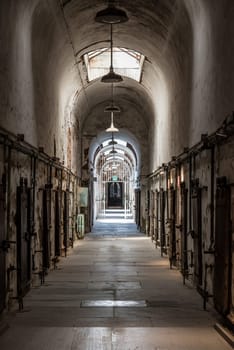 PHILADELPHIA, USA - AUGUST 15, 2022 - Corridor with cells at the old abandoned Eastern State Penitantiary, USA