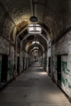 PHILADELPHIA, USA - AUGUST 15, 2022 - Abandoned corridor in the Eastern State Penitentiary in Philadelphia, USA