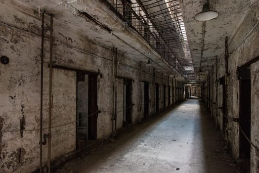 PHILADELPHIA, USA - AUGUST 15, 2022 - Abandoned corridor in the Eastern State Penitentiary in Philadelphia, USA