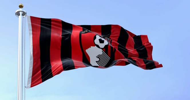Bournemouth, UK, Oct. 4 2022: AFC Bournemouth flag waving on a clear day. English football club based in Kings Park, Boscombe. Illustrative editorial 3d illustration render