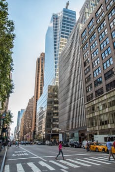 Avenue and skyscraper in downtwon New York, USA