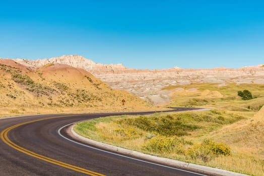 Fascinating colorful hills along the road leading through Badlands National Park, USA
