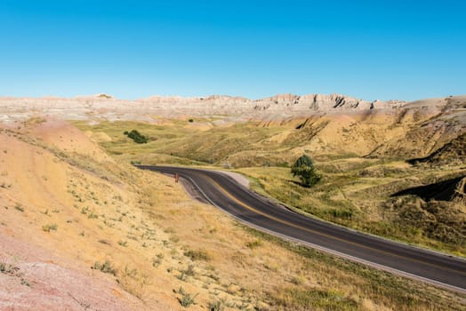 Fascinating colorful hills along the road leading through Badlands National Park, USA
