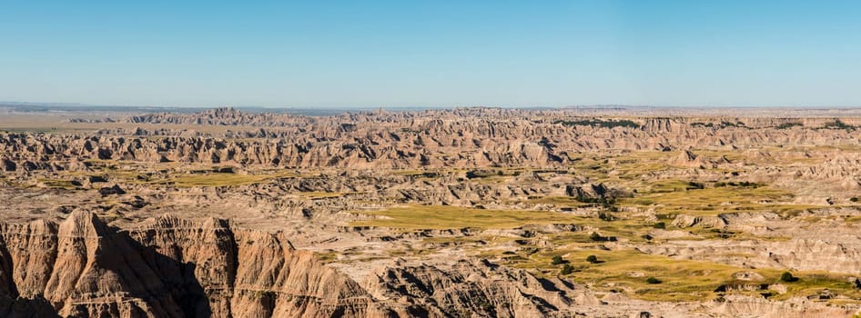 Rugged hills and a wide horizon in Badlands National Park, USA