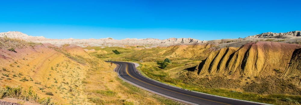 Fascinating colorful hills along the road leading through Badlands National Park, USA
