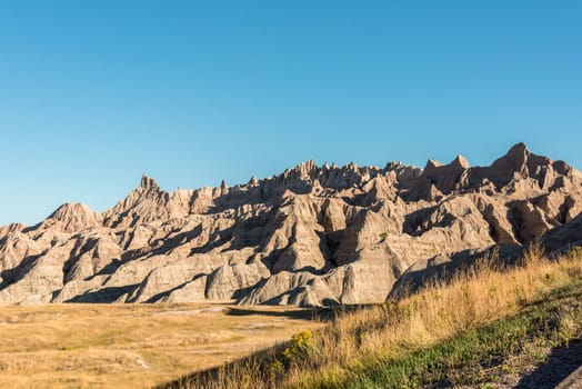 Wide landscape and sandstone hills in the Badlands National Park, USA