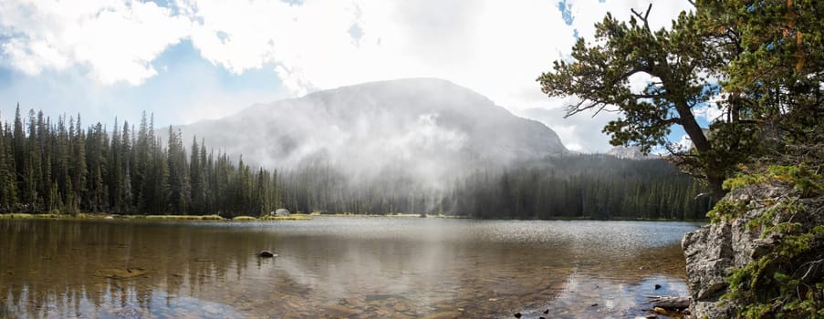 Calm lake Spruce in the middle of the Rocky Mountains NP, USA