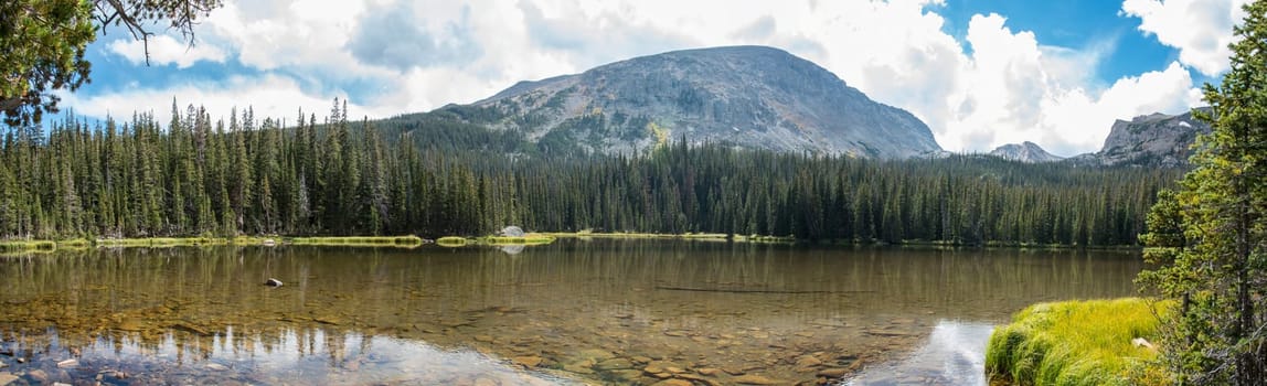 Calm lake Spruce in the middle of the Rocky Mountains NP, USA