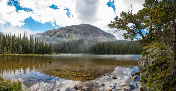 Calm lake Spruce in the middle of the Rocky Mountains NP, USA