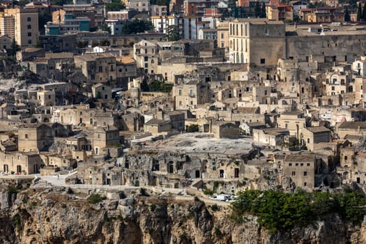 Panoramic view of Sassi di Matera a historic district in the city of Matera, well-known for their ancient cave dwellings from the Belvedere di Murgia Timone,  Basilicata, Italy