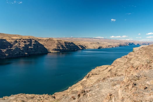 The huge Columbia river in Washington state, dry landscape surrounding the water, USA