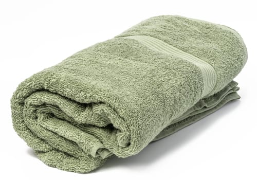 Twisted terry green towel on white background