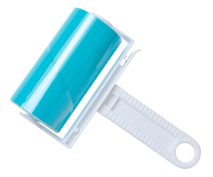 Roller with sticky tape for cleaning clothes on a white background, top view