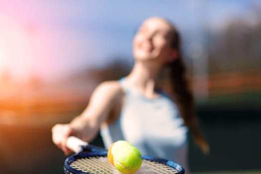 Tennis balls and rocket on court field in sunny day, sport, hobby