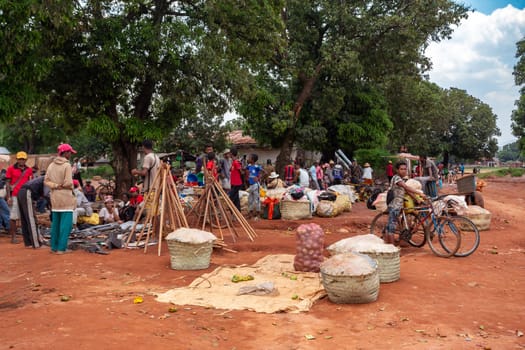 Mandoto, Madagascar - November 9th, 2022: Street market in Mandoto city, with vendors and ordinary people shopping and socializing. In this place you can buy and sell practically everything.