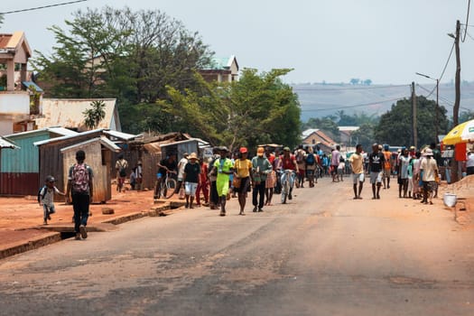 Mandoto, Madagascar - November 9th, 2022: Local residents walking and going about their daily lives on Mandoto street in Madagascar.