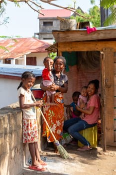 02.11.2022 - Miandrivazo, Madagascar: Two young mothers with their children in front of their house.