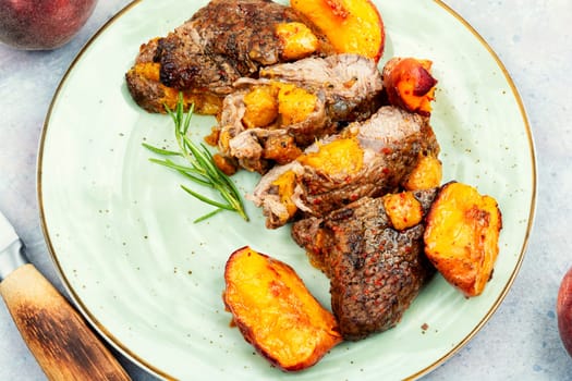 Diet baked veal steak with peach, space for text.