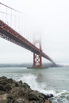 Scenic Golden Gate Bridge in the fog from Fort Poin, San Francisco, USA