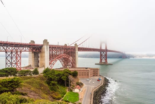 Scenic Golden Gate Bridge in the fog from Fort Poin, San Francisco, USA