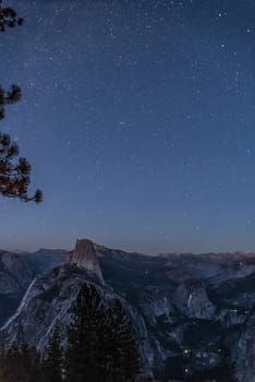 Scenic night sky above the famous Half Dome mountain, Yosemite NP, USA