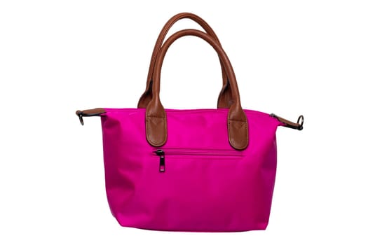 Stylish women's handbag. A fashionable female pink luxury handbag isolated on white. Fashionable womans accessories. Clipping path. Advertising. Space.