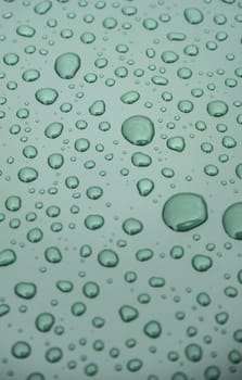 Detail of raindrops on a metallic background, cold and winter