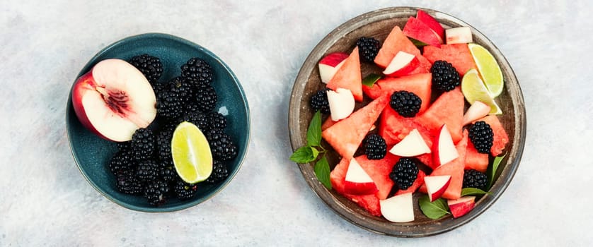 Salad of watermelon, blackberry and peach. Summer fruit diet salad. Detox food