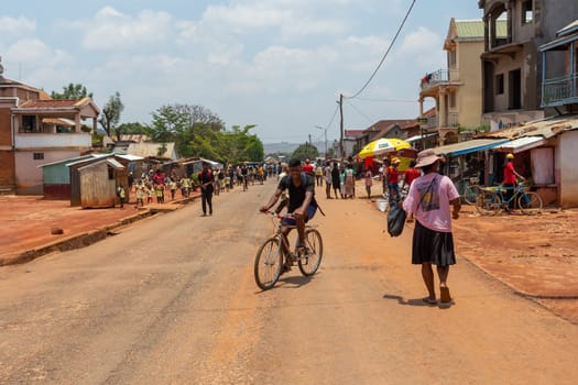 Mandoto, Madagascar - November 9th, 2022: Local residents walking and going about their daily lives on Mandoto street in Madagascar.