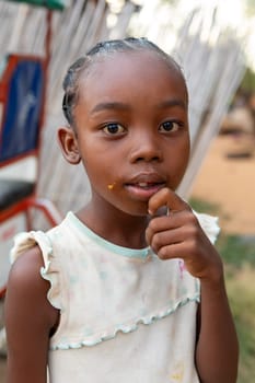 Miandrivazo, Madagascar- November 6. 2022: Small cute Malagasy girl in Miandrivazo, Madagascar.