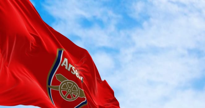 London, UK, august 20 2023: Arsenal Football Club flag waving on a clear day. English professional football club. Illustrative editorial 3d illustration render. Rippled Fabric. Selective focus